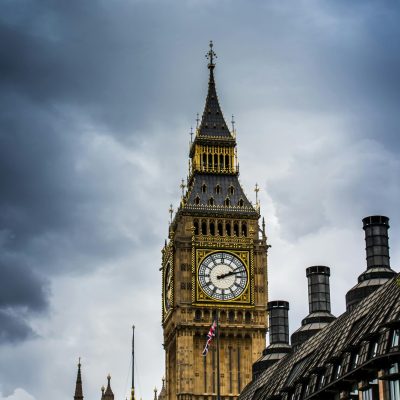 Stunning view of Big Ben in London with dramatic clouds overhead, showcasing iconic architecture.